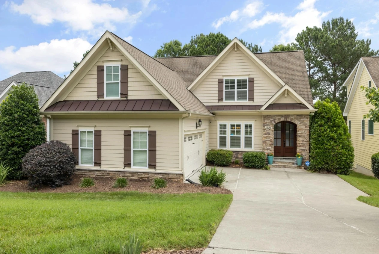 House with weathered brown shutters